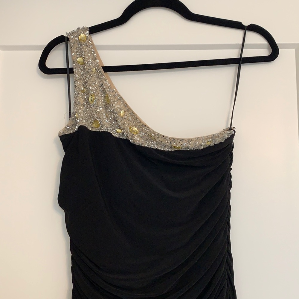 Long black ball gown with embellished neckline